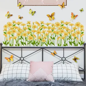 Detail of yellow daisies and 12 pieces 3D butterfly wall stickers on bedroom wall