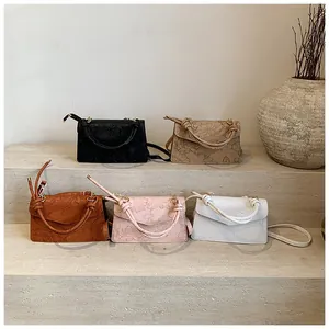 Collection of floral embossed crossbody bags in black, beige, brown, pink, and white