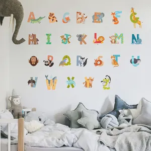 Close-up of colorful animal alphabet wall stickers in a cozy nursery room setting
