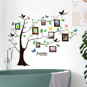 Detail of DIY family tree wall decal with 'Families ARE FOREVER' quote and 8 photo frames