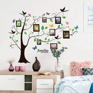 Family tree wall decal with black branches, green leaves and photo frames for home decor