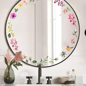 Stickers muraux floraux avec fleurs colorées et feuilles vertes autour d'un miroir de salle de bain