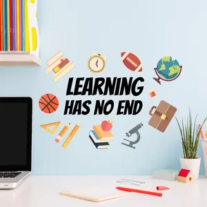 Detail of 'LEARNING HAS NO END' wall sticker with colorful educational icons on a blue wall