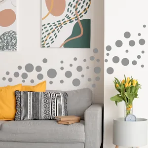 Modern grey polka dot wall decals arranged in dynamic patterns for Nordic living room decor