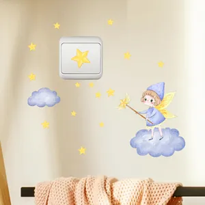 Detailed glow-in-the-dark star fairy wall sticker applied above a light switch in a nursery