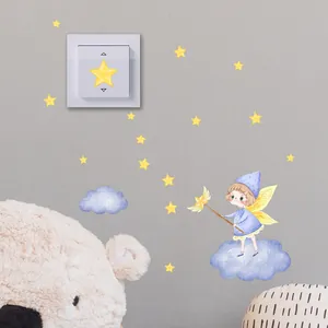 Luminous fairy and stars wall stickers applied around a light switch in a cozy room