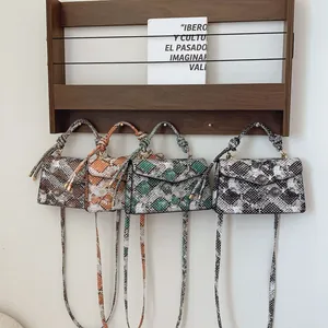 Chic snake-pattern crossbody bags in four colors with knotted handles and long straps
