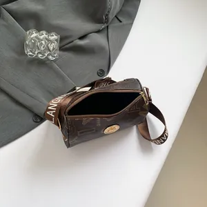 Retro brown cylinder pillow bag with letter print and wide fabric shoulder strap