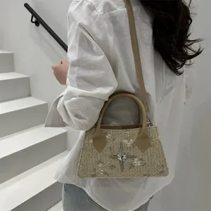 Fashion woven straw crossbody bag with floral embroidery and star metal accessory