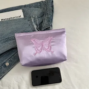Chic light purple satin clutch bag featuring intricate dark pink butterfly embroidery details