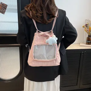 Pink nylon ita bag backpack with transparent window and cute star plush pendant detail