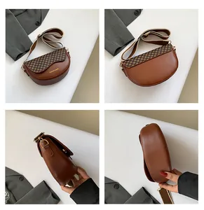 Detail view of brown saddle bag featuring checkered flap and wide khaki strap