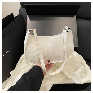 Unboxing view of white crocodile pattern underarm bag with matching gift box and dust bag