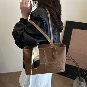 Brown tote bag with silk scarf detail and textured stitching for women’s casual wear