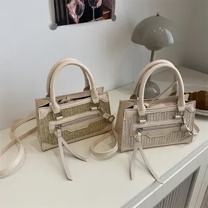 Vintage straw woven crossbody handbag with retro texture and leather trim detailing