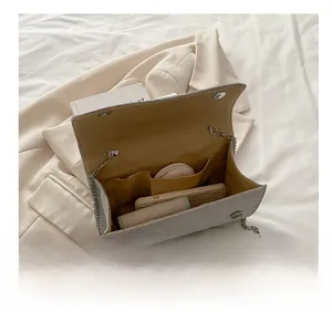 Top view showing large capacity interior of silver chain bag with pockets