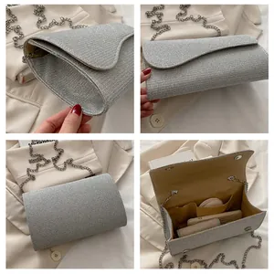 Detailed views of silver glitter square clutch bag with metal chain and interior pockets