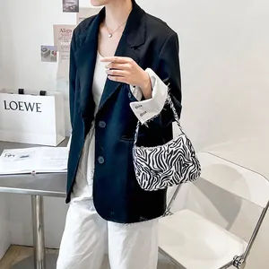 Fashionable zebra print shoulder bag for women with minimalist black and white fabric design