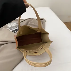 Minimalist beige tote bag interior with large capacity and magnetic closure for work