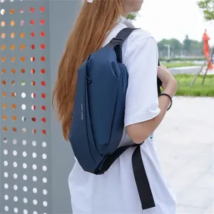 Outdoor shot showing a dark blue waterproof nylon chest bag with sport lettering print