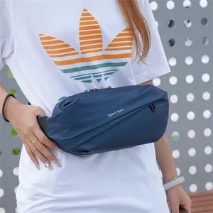Detail of navy blue waterproof nylon chest bag with white Sport male logo print