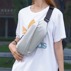 Detailed view of silver crossbody chest bag with Sport Male print and adjustable strap