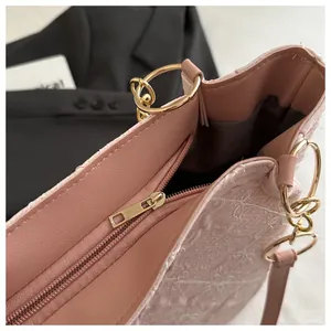 Detailed macro view of the inner zipper pocket with high-quality gold hardware and lining