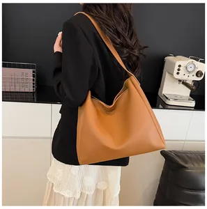 Brown leather tote bag for women showing spacious interior and premium matte texture