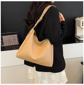 Large capacity trapezoidal tote bag with wide adjustable shoulder strap in warm beige