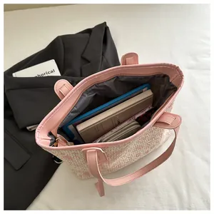 Top view of pink houndstooth woven tote showing spacious interior and fabric lining