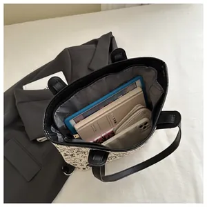 Top view of large tote bag interior showing space for tablet, book, wallet and phone