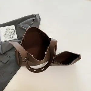 Vintage dark brown leather tote bag with matching pouch and rivet strap detail