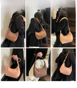 Detailed views of stylish hobo shoulder bags in pink and brown being worn by a model