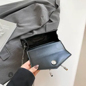 Chic black bow square chain bag with silver buckle and interior storage view
