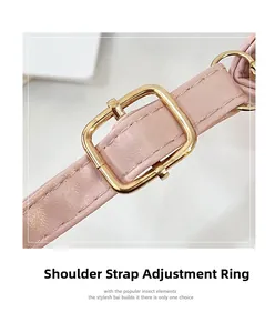 Detail of pink leather shoulder strap with adjustable gold metal buckle for luxury bags