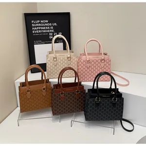 Detailed display of elegant monogram handbags in five colors with textured PU finish