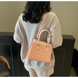 Detailed back view of pink vintage monogram handbag with detachable shoulder strap