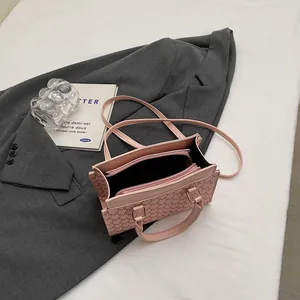 Pink vintage monogram handbag with shoulder strap and organized multi-layer interior