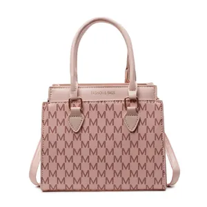 Pink vintage tote bag with M-letter print and fashion text on a white background
