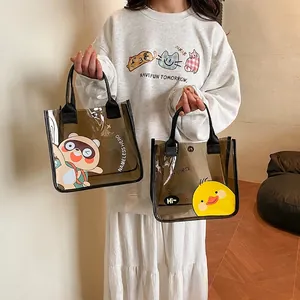 Borsa tote trasparente in PVC marrone con stampe di cartoni animati e manici neri
