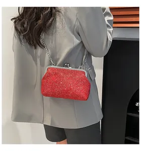 Red sequined cross-body mini bag with silver metal ball chain shown on a model