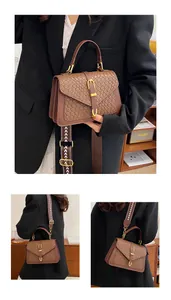 Macro shot of dark brown woven leather texture and geometric patterned strap on small bag