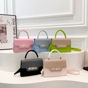 Women stylish leather crossbody bags in pastel colors with metal buckles and top handles