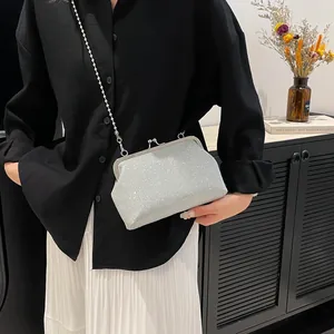 Elegant silver sequin evening clutch bag with pearl handle and detachable chain strap