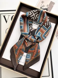 Close-up of geometric print silk scarf in premium gift box with luxury aesthetic styling