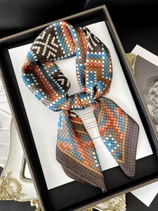 Macro shot of colorful geometric silk scarf texture with detailed twill weave pattern