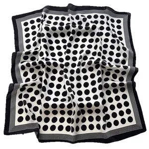 Elegant silk-like square scarf with black polka dots and striped border on white background