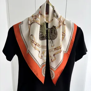 Elegant equestrian silk scarf with orange border and horse bridle print pattern decoration