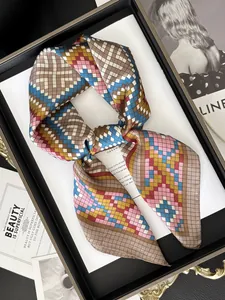 Detail of elegant patterned silk scarf with colorful geometric checkered print texture