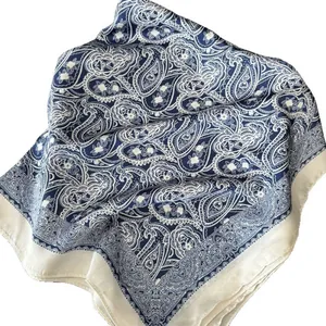Navy blue and white paisley silk scarf with smooth texture shown on white background